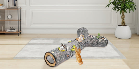 Three cats playing on a realistic log-shaped cat tunnel toy in a bright living room