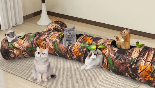 Four cats playing and resting on a camouflage cat tunnel bed for indoor cats on a carpet
