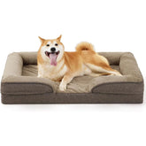 Happy dog lying on a comfortable FelRelWel dog sofa bed with plush cushioning and raised edges