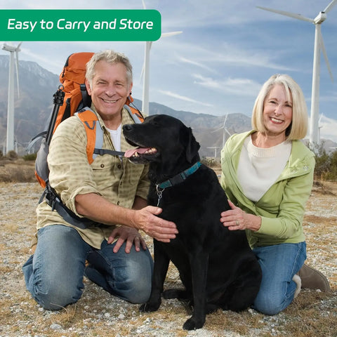 FelRelWel Dog Flirt Pole dog teaser wand used by happy couple playing with black dog outdoors