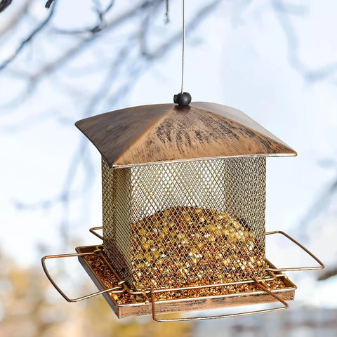 FelRelWel squirrel proof bird feeder with metal mesh design and copper roof hanging outdoors